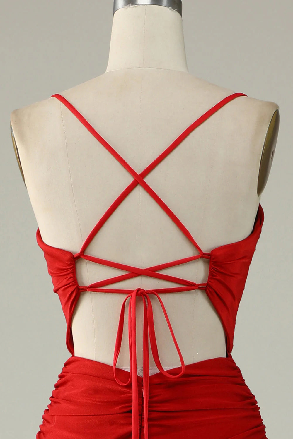 Close-up of the delicate beading detail on the red prom dress.
