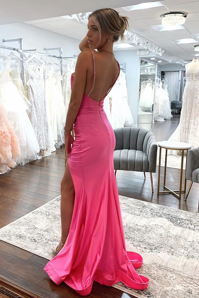 Side view of the pink satin mermaid prom dress, showcasing its silhouette.