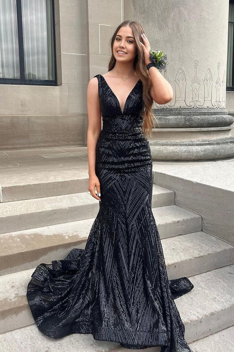 Model wearing an elegant black sequin mermaid V-neck long formal dress.