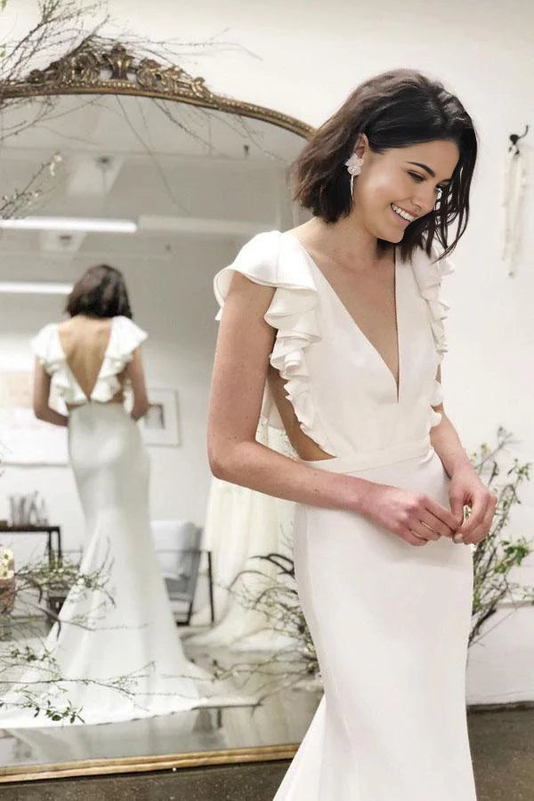 Back view of mermaid wedding dress, showcasing backless design and cascading ruffles.