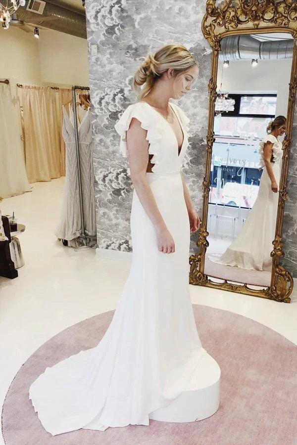 Back view of a mermaid wedding gown showing the ruffled train.