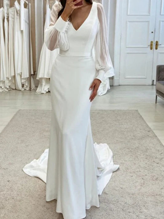 Elegant mermaid V-neck wedding dress with long sleeves, floor-length design.