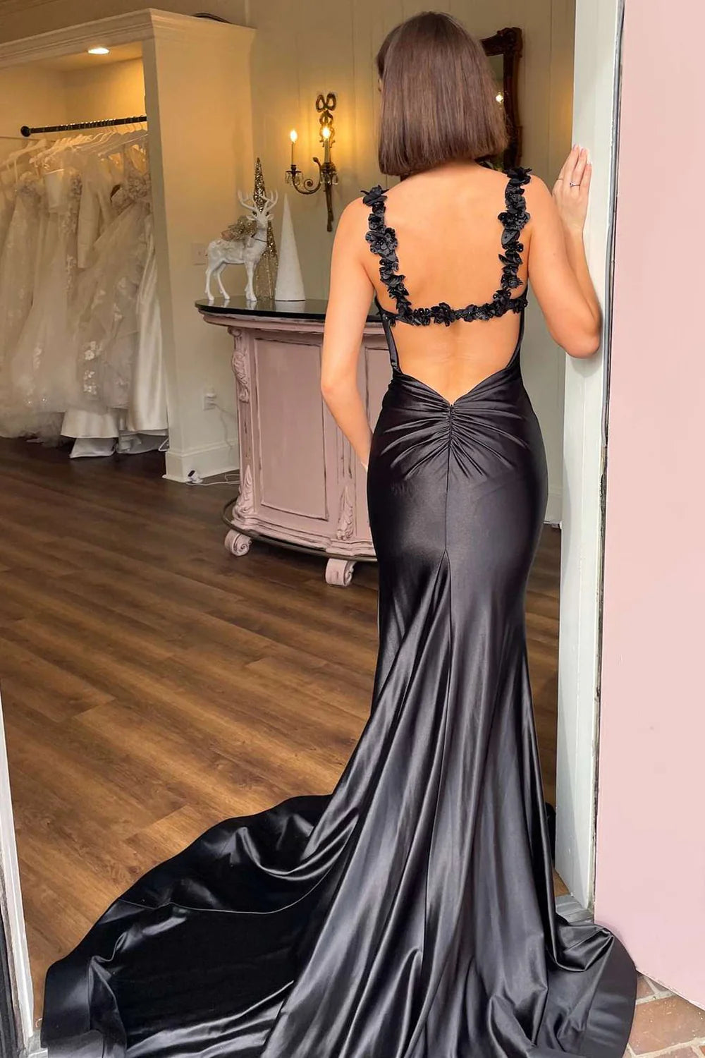 Back view of a mermaid V-neck floral long prom dress, showcasing the flowing skirt.