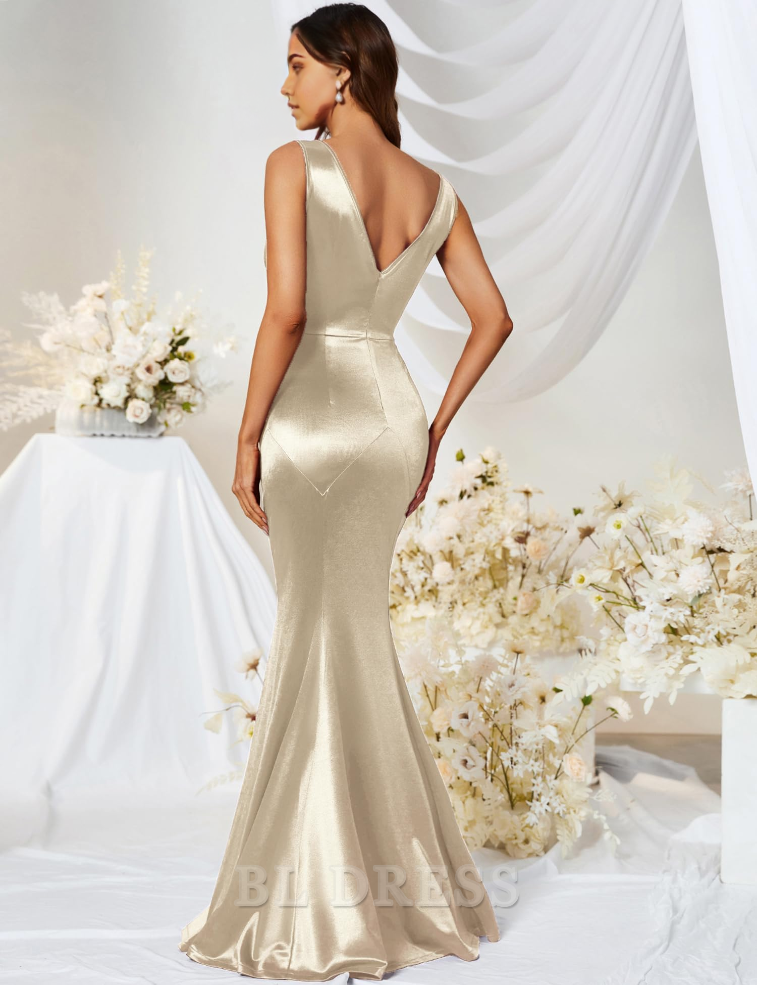 Side view of a woman wearing a navy mermaid V-neck formal gown.