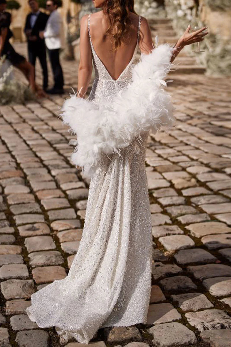 Close-up of the V-neckline and bodice details of the wedding dress.