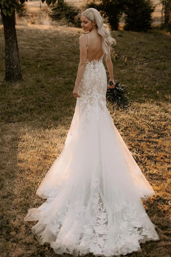 Back view of a mermaid V-neck bridal gown with intricate lace details.