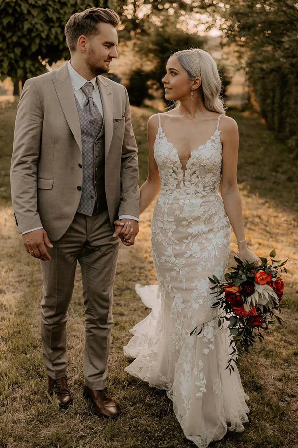 Side profile of a long mermaid wedding dress with a V-neckline.
