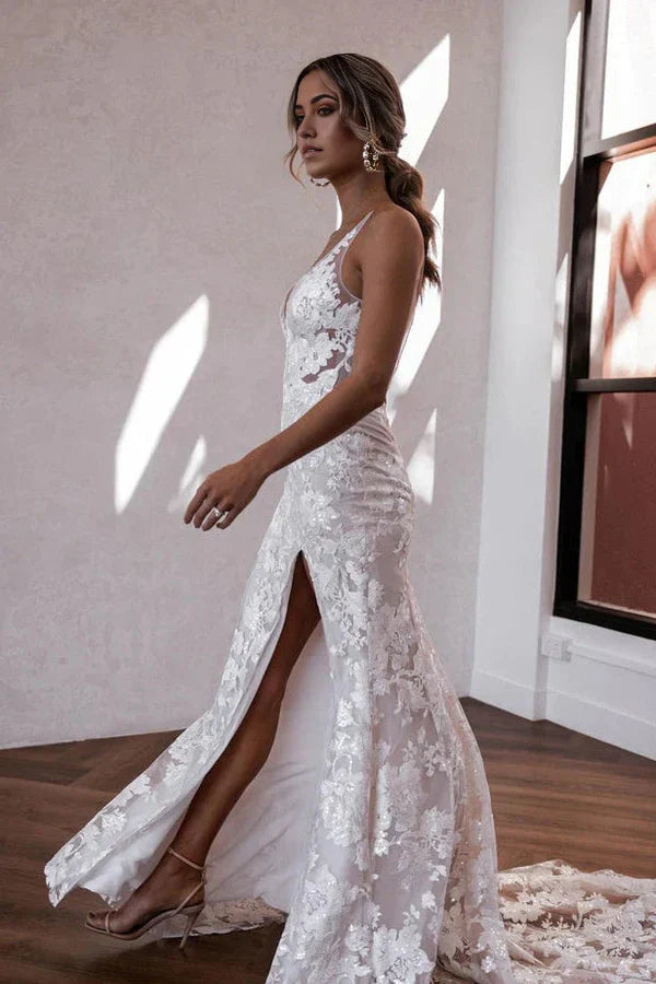 Close-up of the intricate lace detail on the V-neckline of the wedding dress.