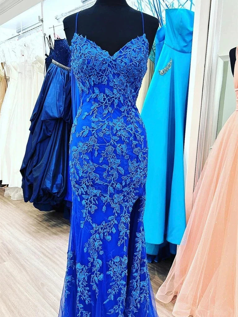 Woman wearing an elegant mermaid V-neck lace prom dress.
