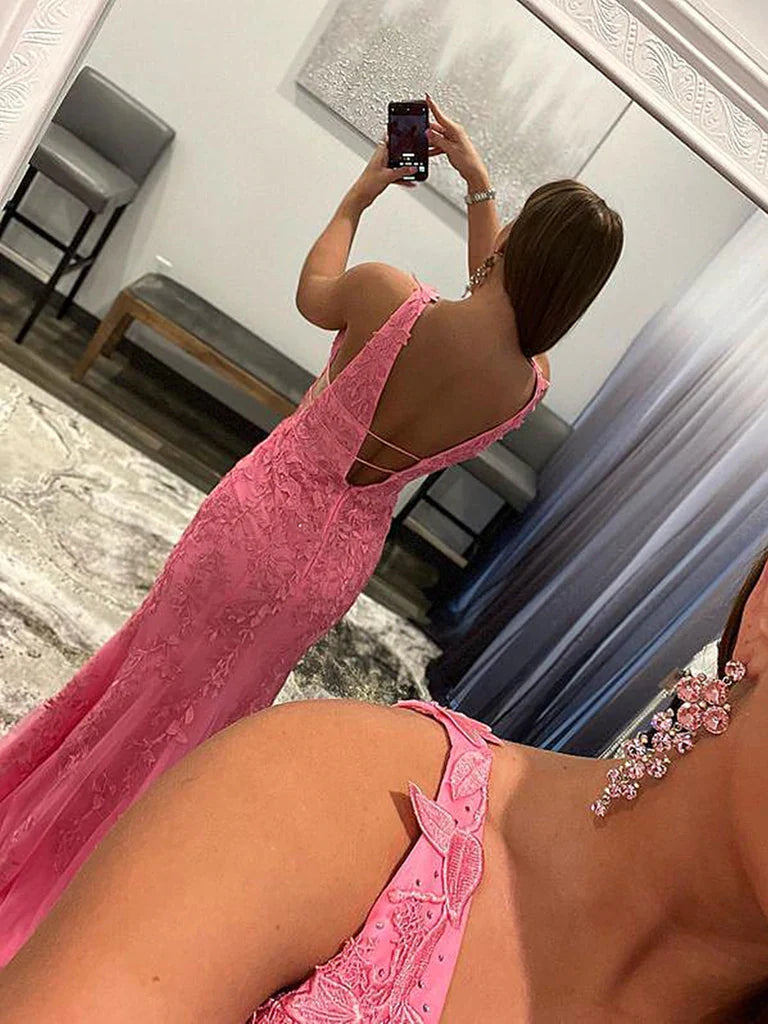 Back view of a woman in a mermaid V-neck lace prom dress, highlighting intricate lace details.