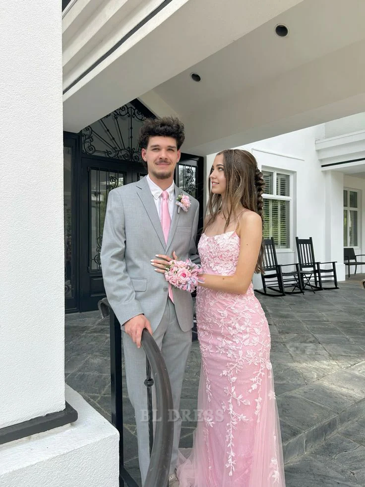 Elegant pink mermaid formal dress with spaghetti straps and lace details.