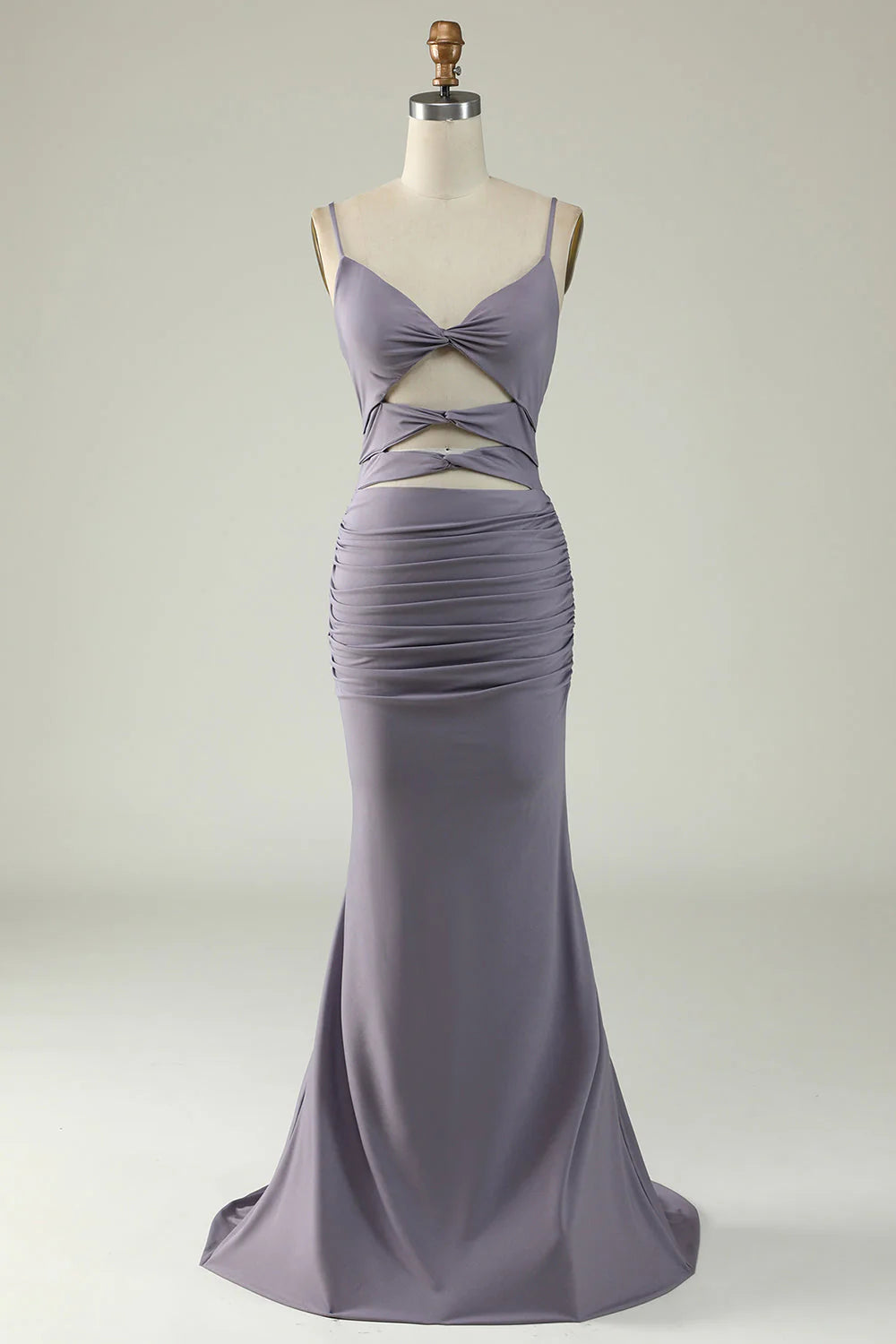 Woman wearing an elegant grey-purple mermaid prom dress with a V-neckline.