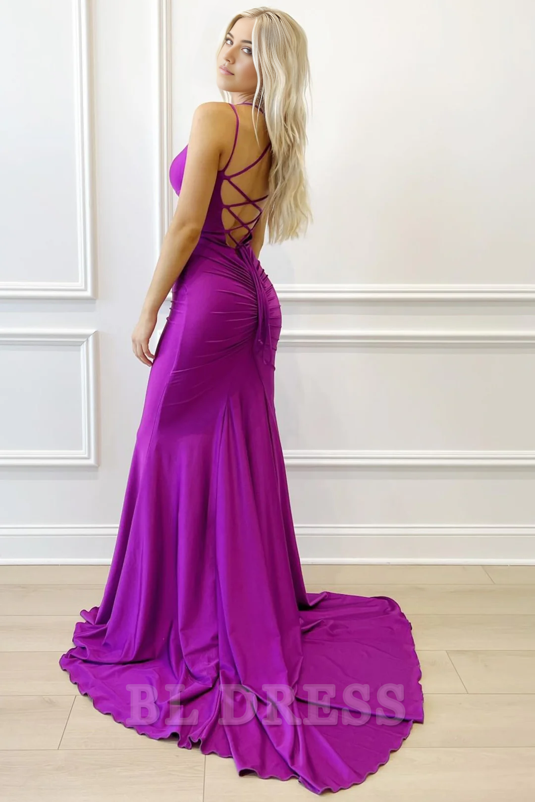 Side view of a purple mermaid evening gown with V-neck.