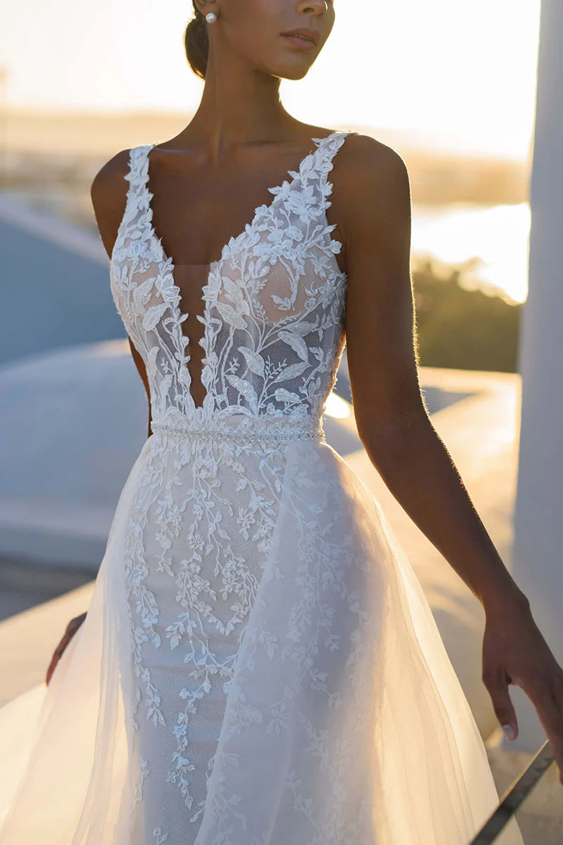 Full view of an elegant mermaid V-neck lace wedding dress.