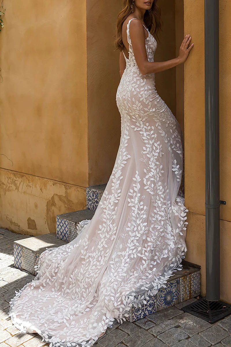 Close-up of the intricate lace detailing on the mermaid wedding dress.