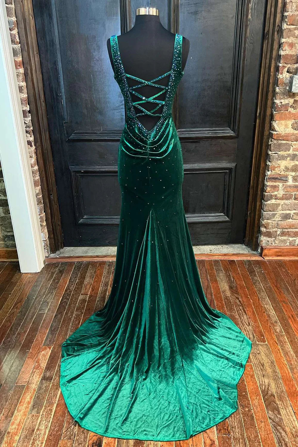 Back view of a model showcasing the cutout detail of the mermaid V-neck prom dress.