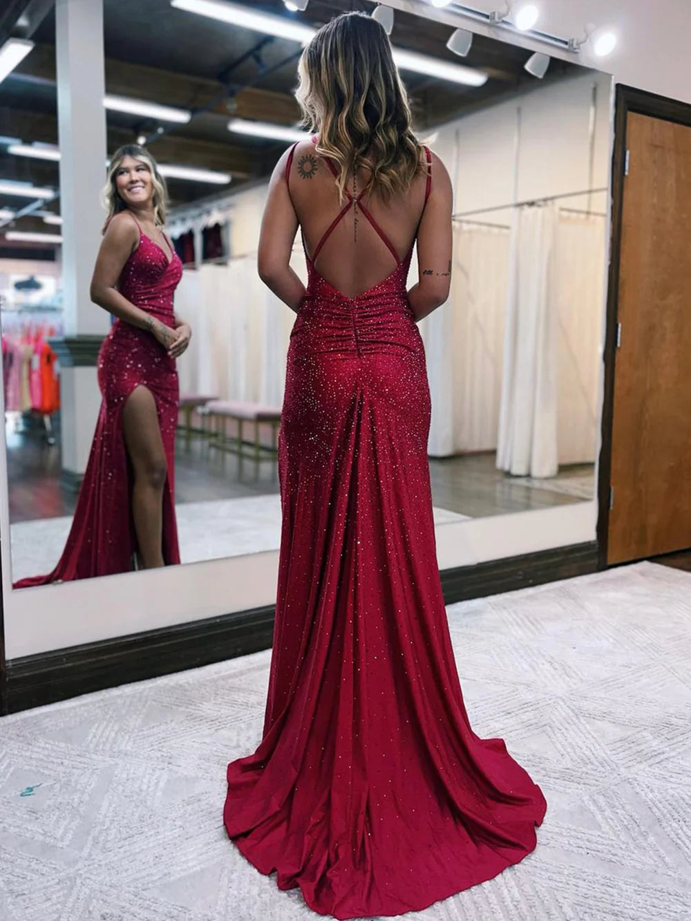 Side view of the mermaid prom dress, highlighting the graceful silhouette and thigh-high slit.