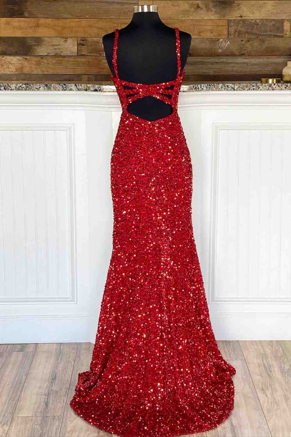 Full view of a red mermaid prom gown.