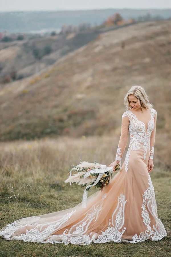 Back view of a mermaid wedding dress showing intricate appliques and train.