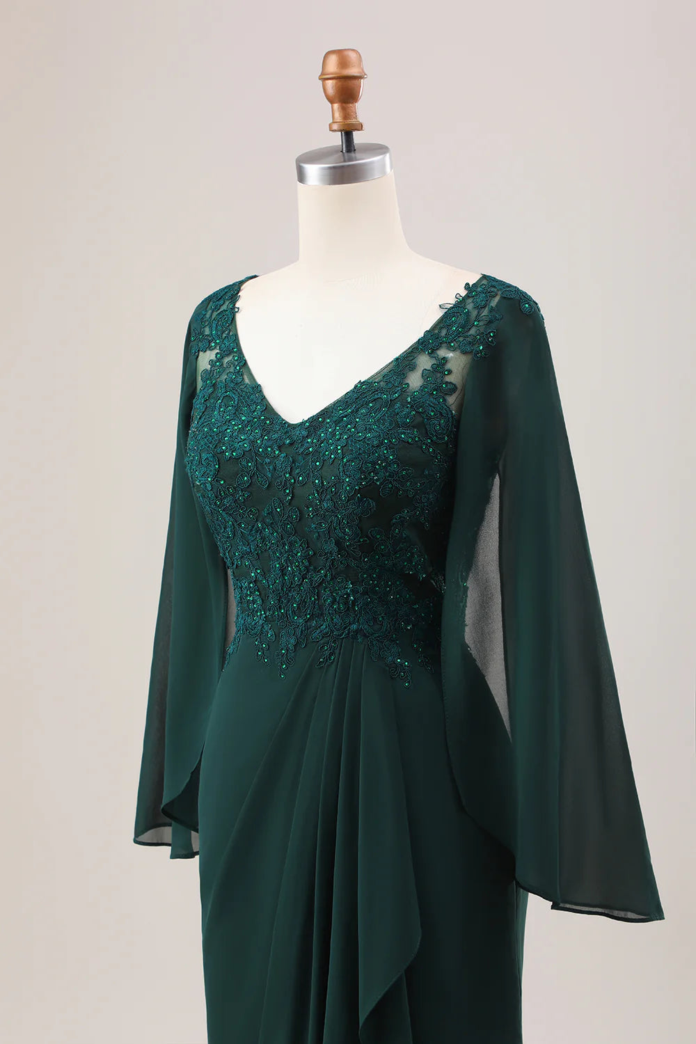 Back view of a dark green mermaid mother of the bride dress.