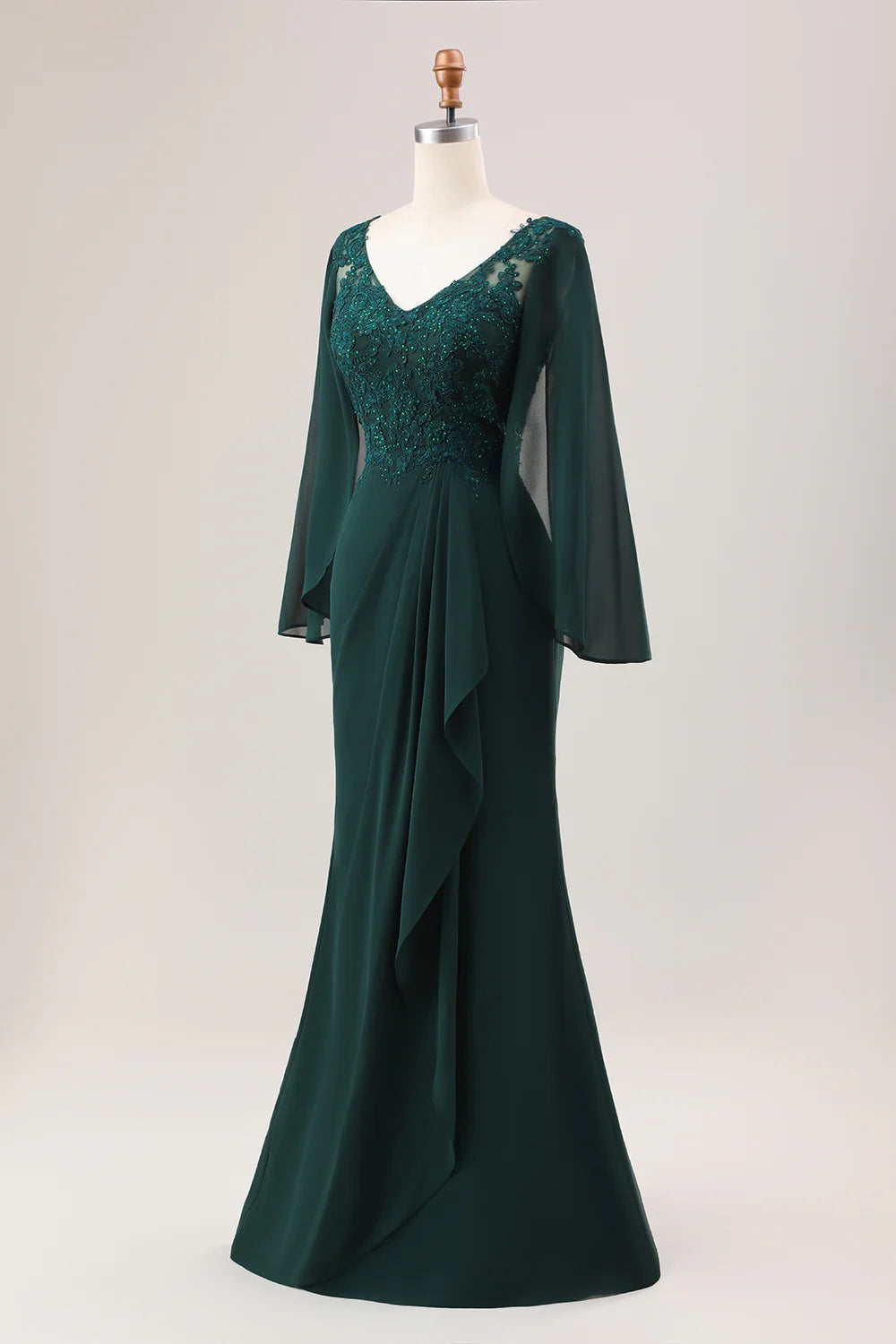 V-neckline and long sleeve detail of the dark green formal dress.
