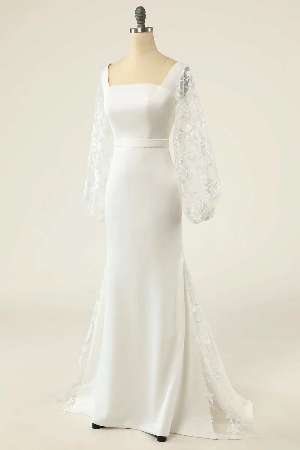 Close-up of the V-neck bodice and lace long sleeves on a wedding dress.