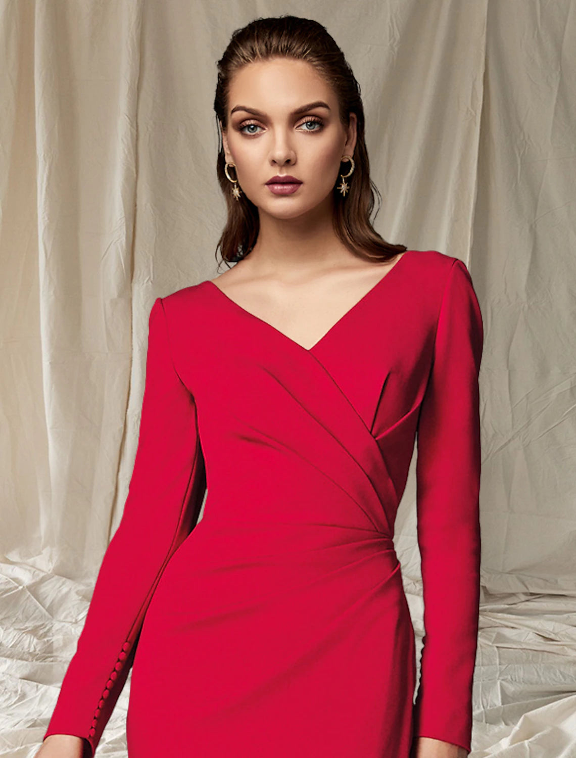 Side profile of the V-neck mermaid dress highlighting the side-draped detail.