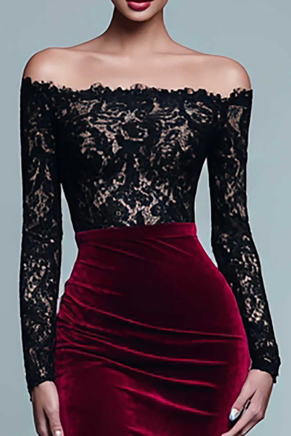 Close-up of lace detail on black and burgundy velvet dress sleeve.
