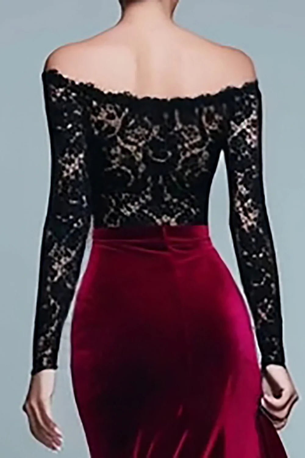 Back view of black and burgundy velvet mermaid dress with long sleeves.