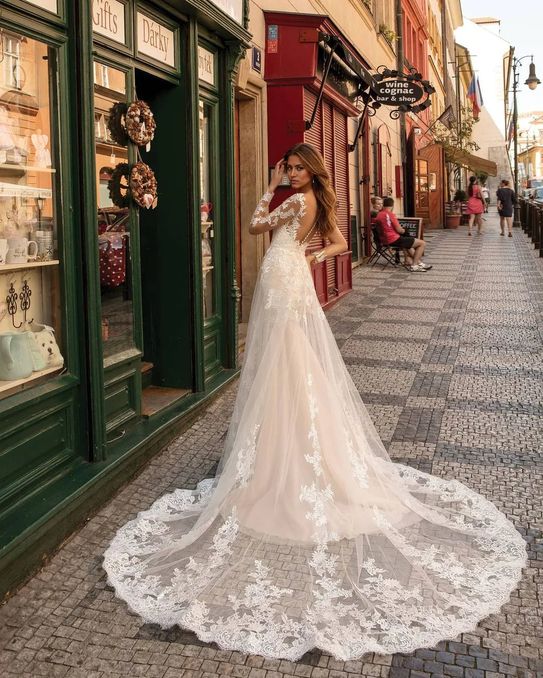 Back view of a mermaid bridal gown with intricate lace details.