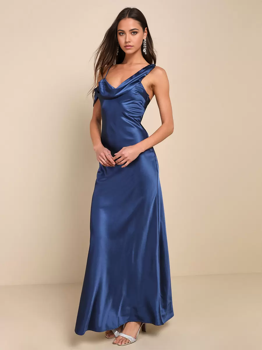 Back view of the asymmetrical mermaid gown, highlighting the open back detail.