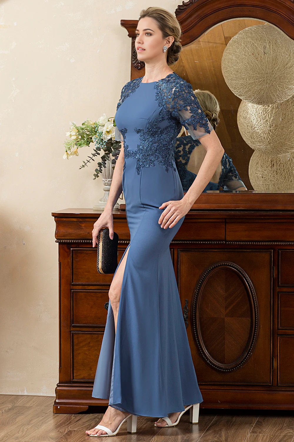 Close-up of the V-neck bodice of the mermaid Mother of the Bride dress.