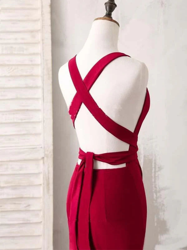 Back view of mermaid V-neck satin gown showing open back and sweep train.