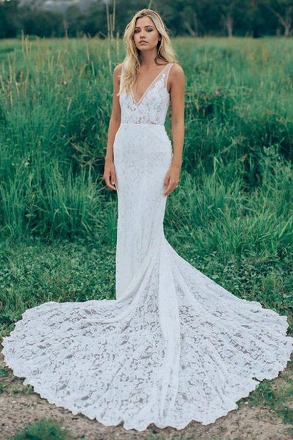 Full-length view of an elegant mermaid V-neck lace wedding dress with a court train.