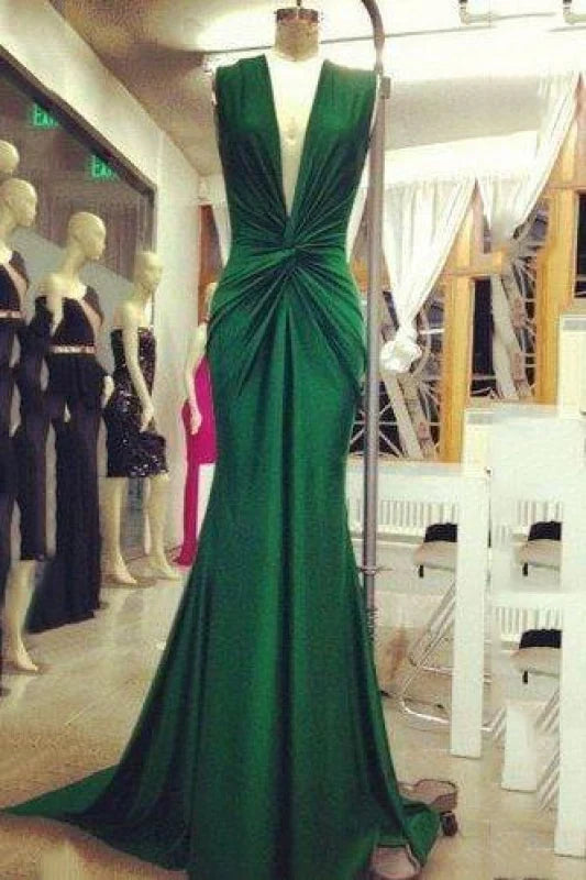 Elegant dark-colored mermaid evening gown with deep V-neck and ruched detailing.