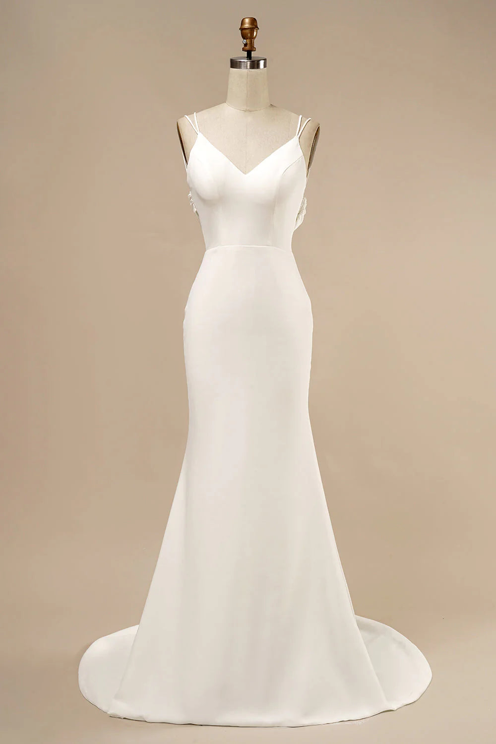 Elegant white mermaid wedding gown with ruffles.