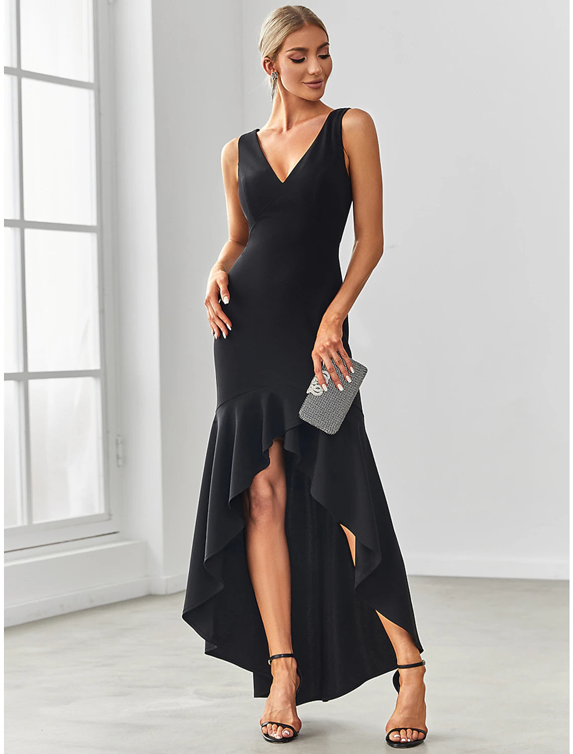 Full-length view of the blue mermaid V-neck evening gown with ruffles and draping.