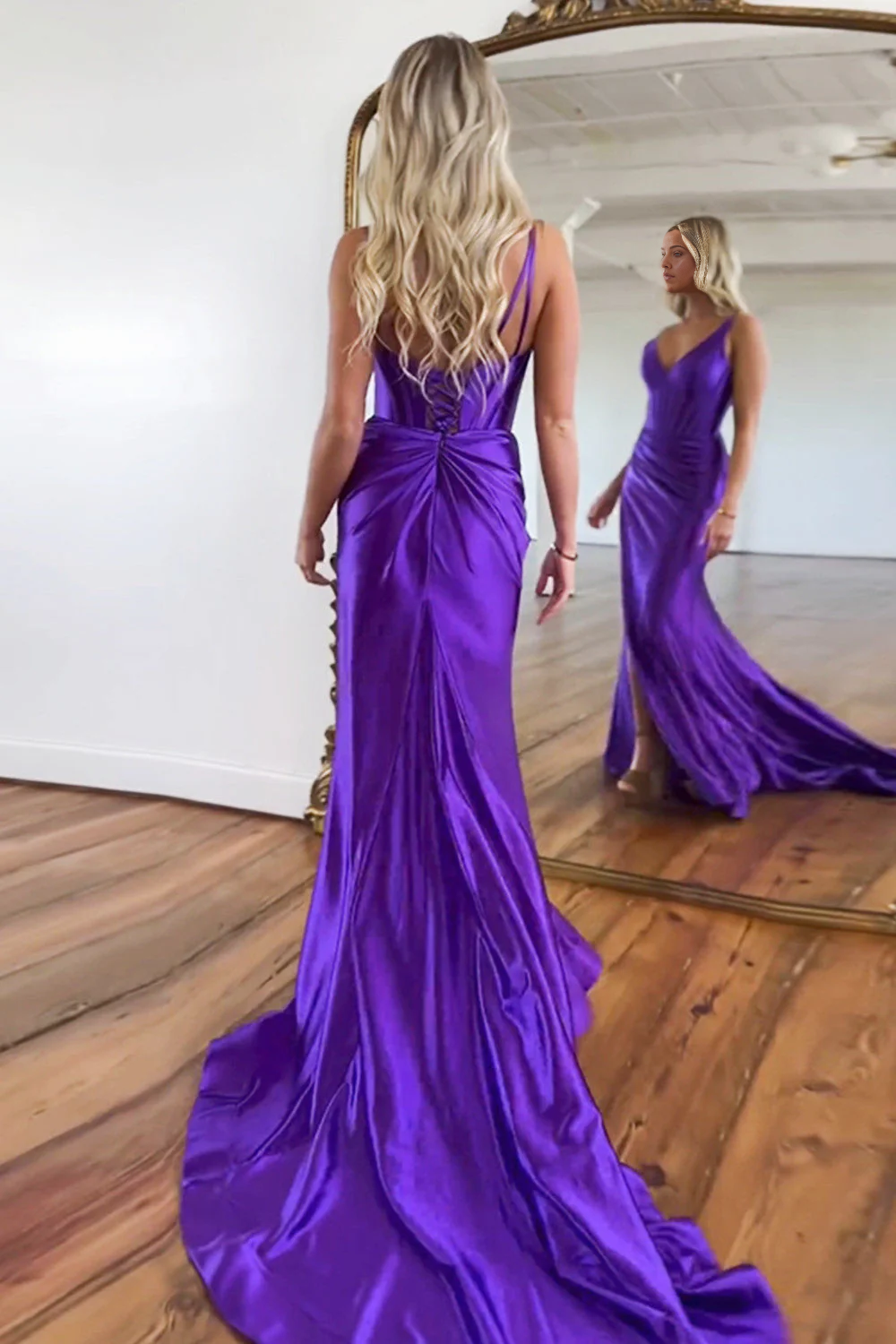 Back view of a purple mermaid satin dress showing the zipper closure.
