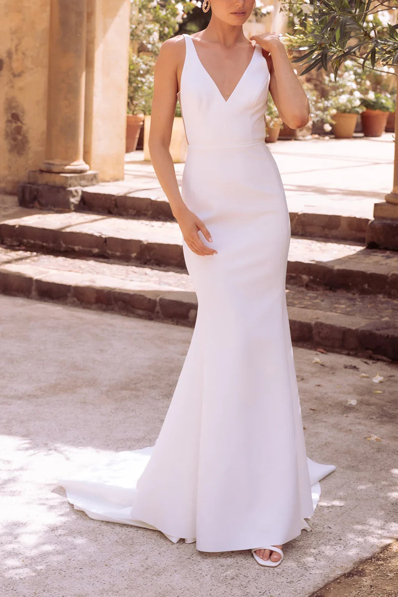 Elegant mermaid V-neck satin wedding dress, front view.