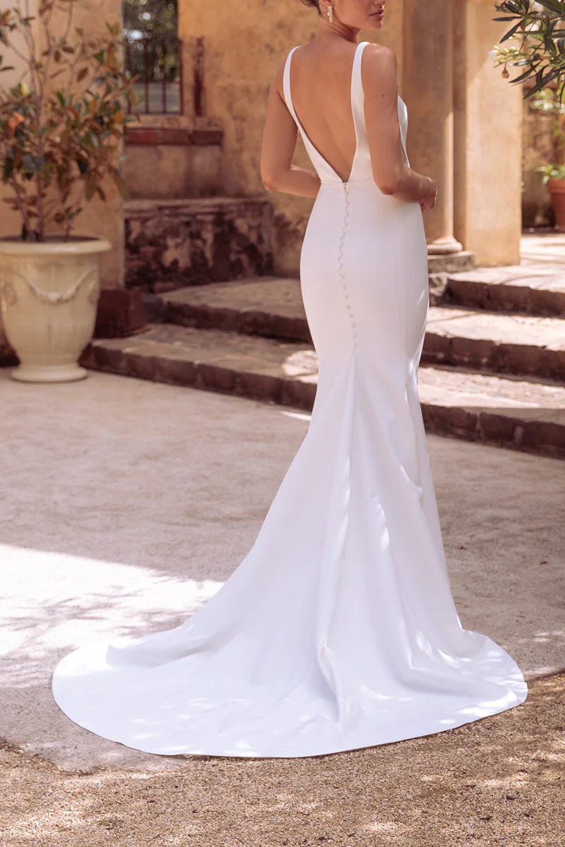 Side view of the satin mermaid bridal gown.