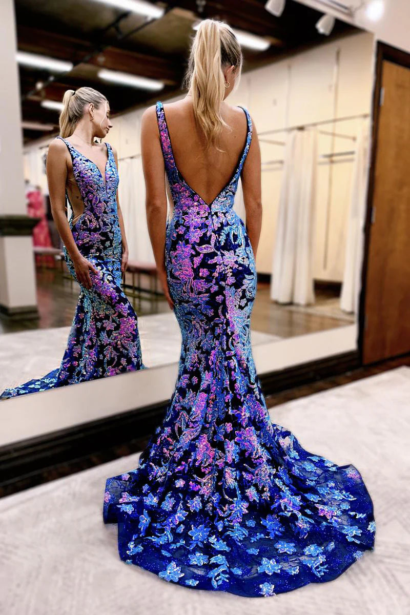Back view of a long sequin and lace mermaid gown.