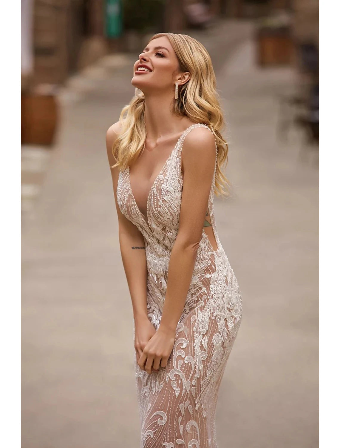 Elegant V-neck mermaid satin wedding dress with appliques and court train.