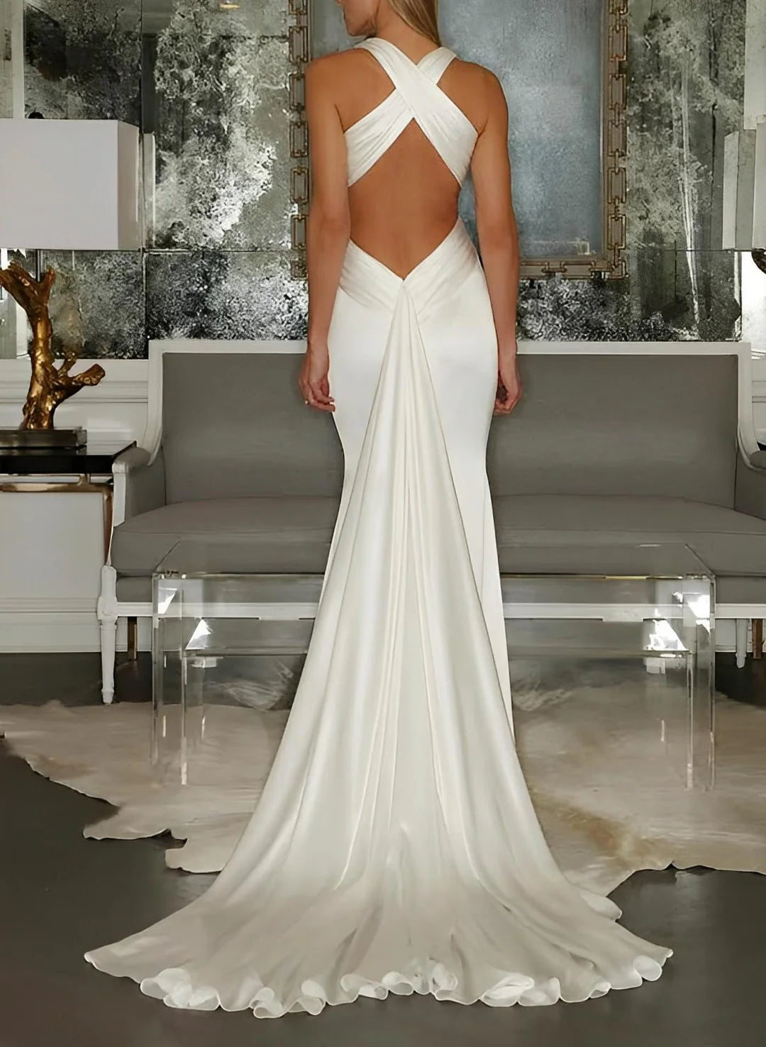 Back view of a mermaid floor length bridal gown.