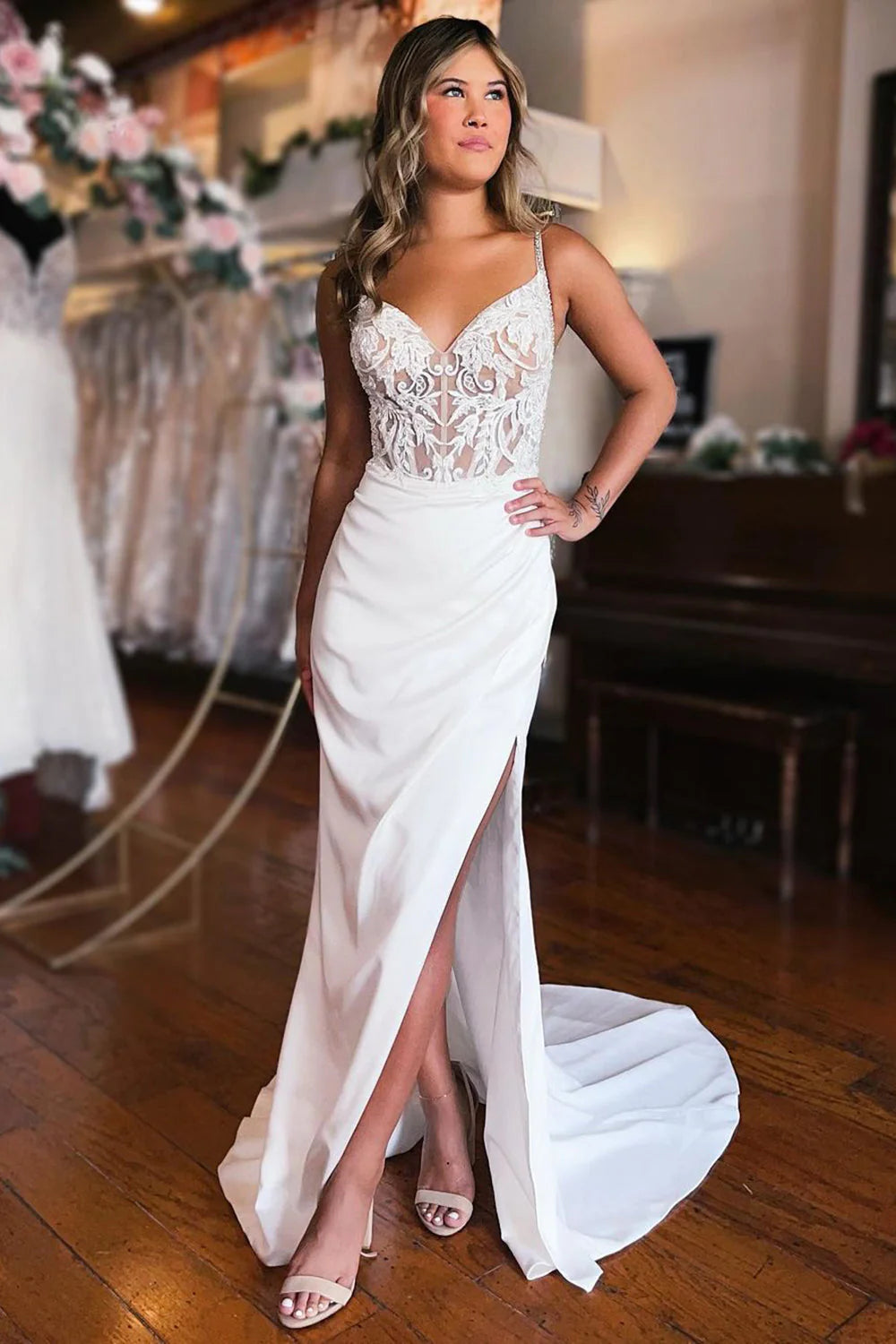 Elegant white mermaid wedding dress with lace back and front slit.