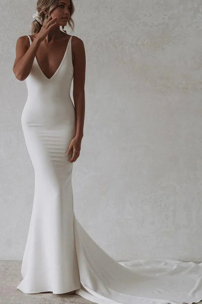 Elegant mermaid V-neck satin wedding dress with a long train.