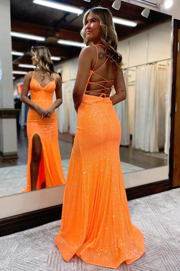 Close-up of shimmering sequin fabric and V-neckline on a mermaid dress.