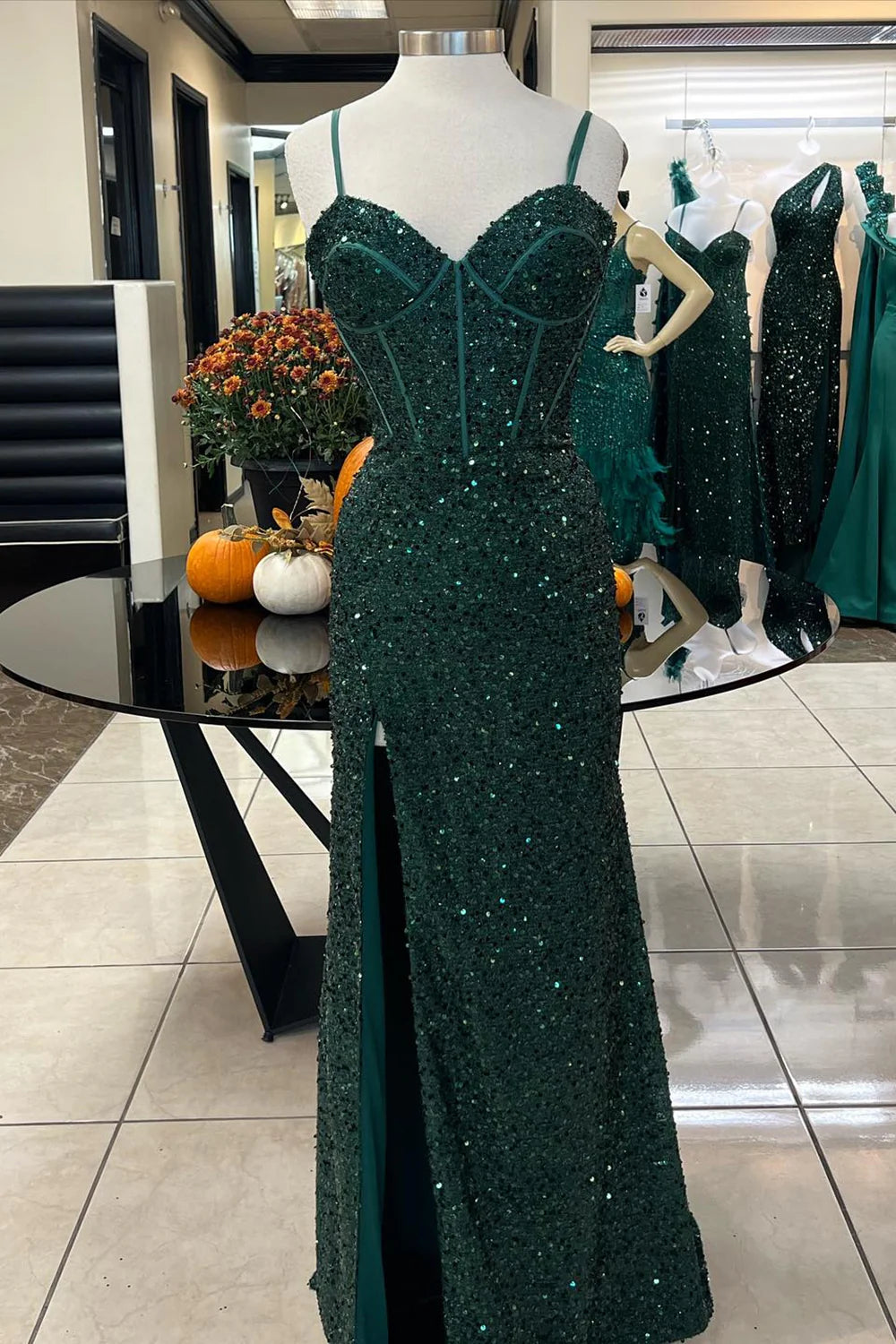 Elegant mermaid prom dress with a high slit, front view.