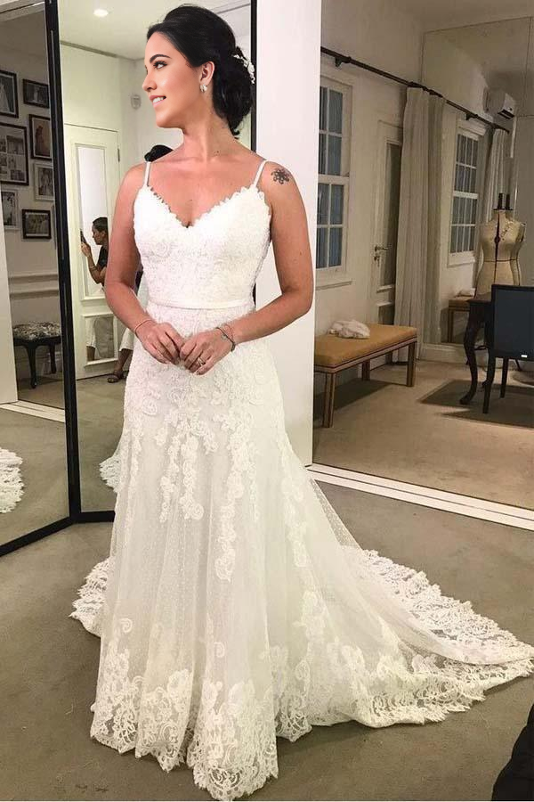 Front view of an elegant Mermaid V-Neck spaghetti strap lace wedding dress.