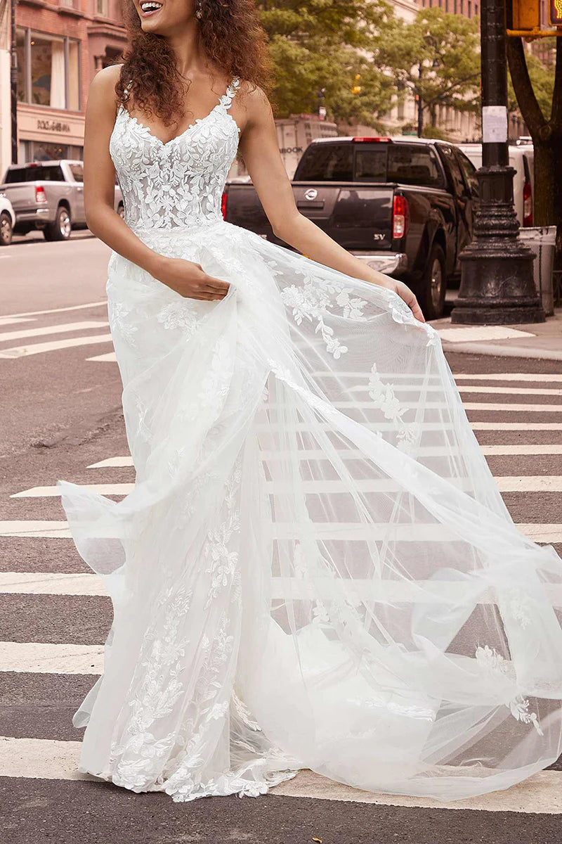 Full length view of a bride wearing a mermaid wedding dress.