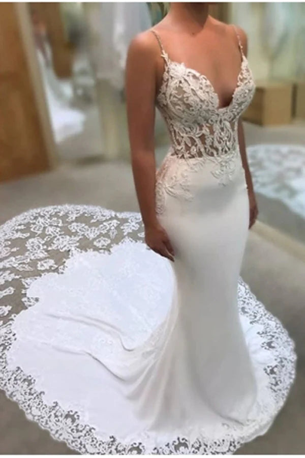 Mermaid lace wedding dress with spaghetti straps and sweep train.